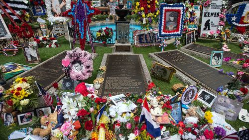 Visitors have left gifts and tokens at the singer's grave. (AAP)