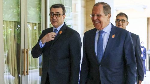 In this handout photo released by Russian Foreign Ministry Press Service, Russian Foreign Minister Sergey Lavrov, right, and Brazil Foreign Minister Carlos Alberto Franca walk during their bilateral meeting ahead of the G20 Foreign Ministers' Meeting in Nusa Dua, Bali, Indonesia, Bali, Indonesia, Friday, July 8, 2022. (Russian Foreign Ministry Press Service via AP)