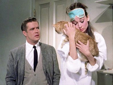 Scene from Breakfast at Tiffany's with Audrey Hepburn holding 'Cat'