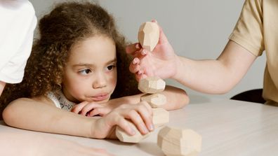 Girl playing with building blocks