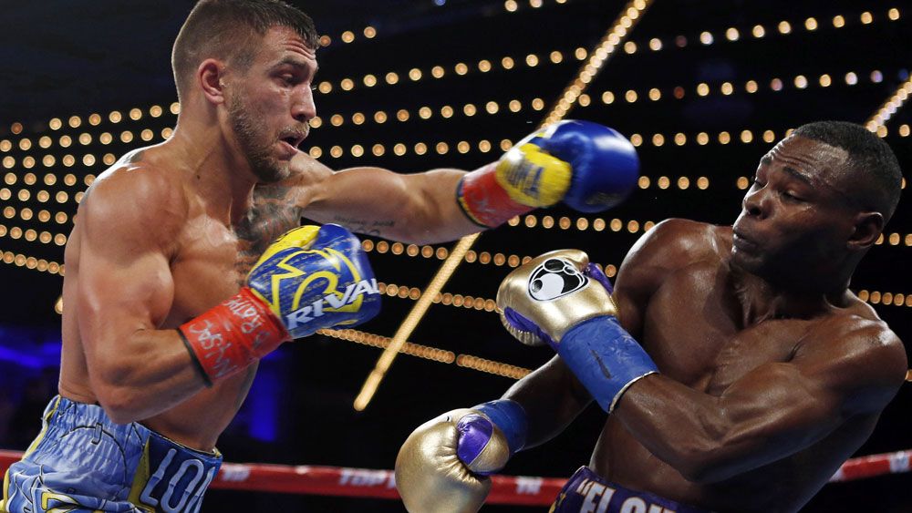 Vasyl Lomachenko wins boxing super-featherweight world title fight after Guillermo Rigondeaux quits