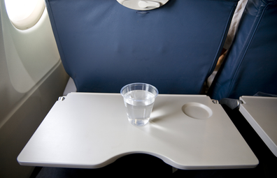 Cup of water on a plane