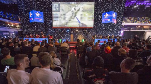 Gamers watch a cup game between Denmark and Australia playing Counter Strike Global Offensive in London last year. (AAP)