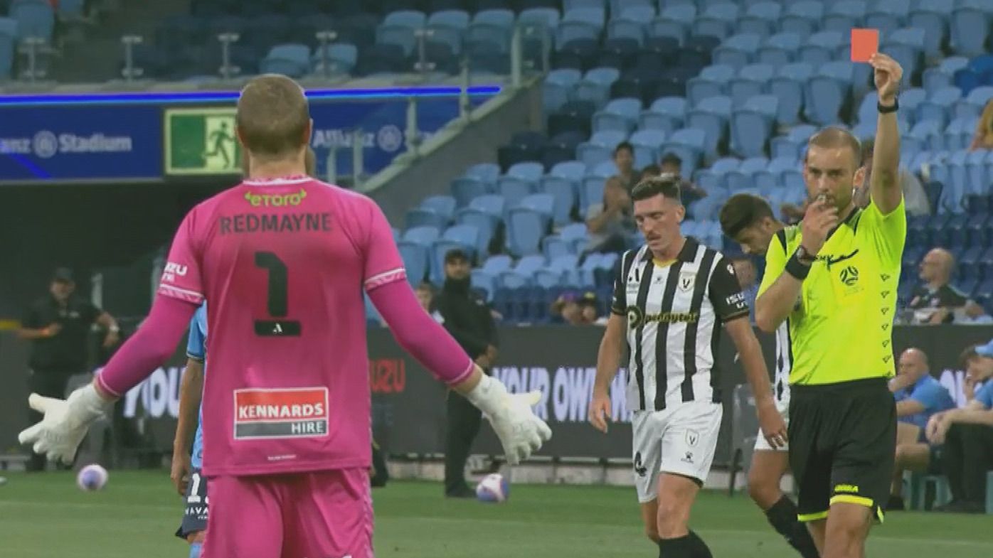 Sydney FC goalkeeper Andrew Redmayne reacts to the red card given as a result of a handball in the first half of the A-League clash against Macarthur.