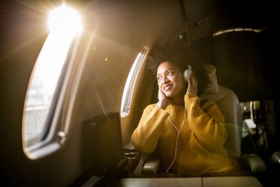 Woman plane (Getty/iStock)