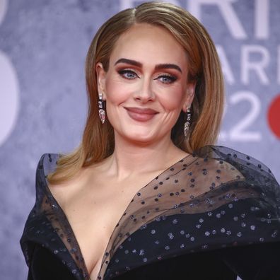 Adele poses for photographers upon arrival at the Brit Awards 2022 in London Tuesday, Feb. 8, 2022. 