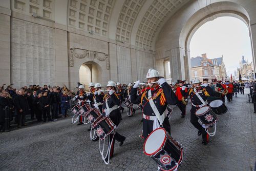 A drums and pipes band marches during an Armistice Day ceremony at the Menin Gate Memorial to the Missing in Ypres, Belgium, Friday, November 11, 2022.