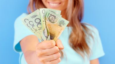 Woman holding cash