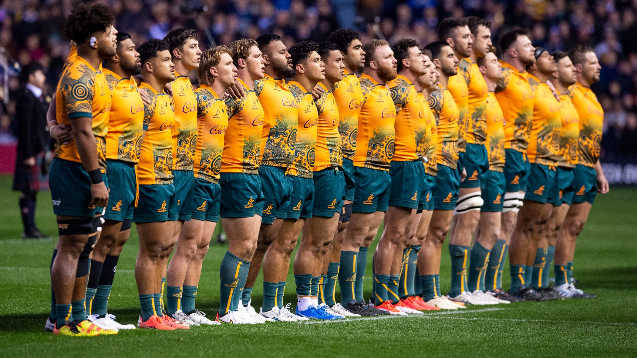The Australian team sing Advance Australia Fair.