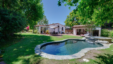 The pool and spa in the home's private backyard.