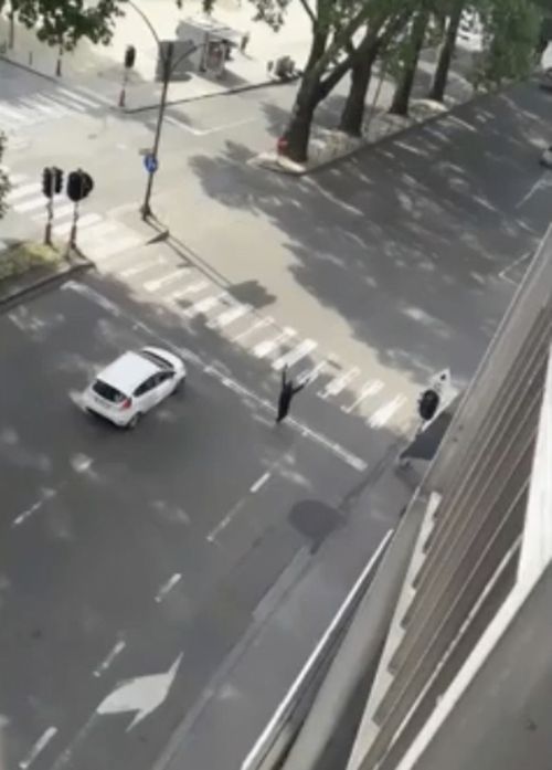 Benjamin Herman walks towards police with his hands in the air after his horror rampage. Picture: AP