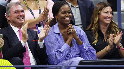 Former first lady Michelle Obama watches on