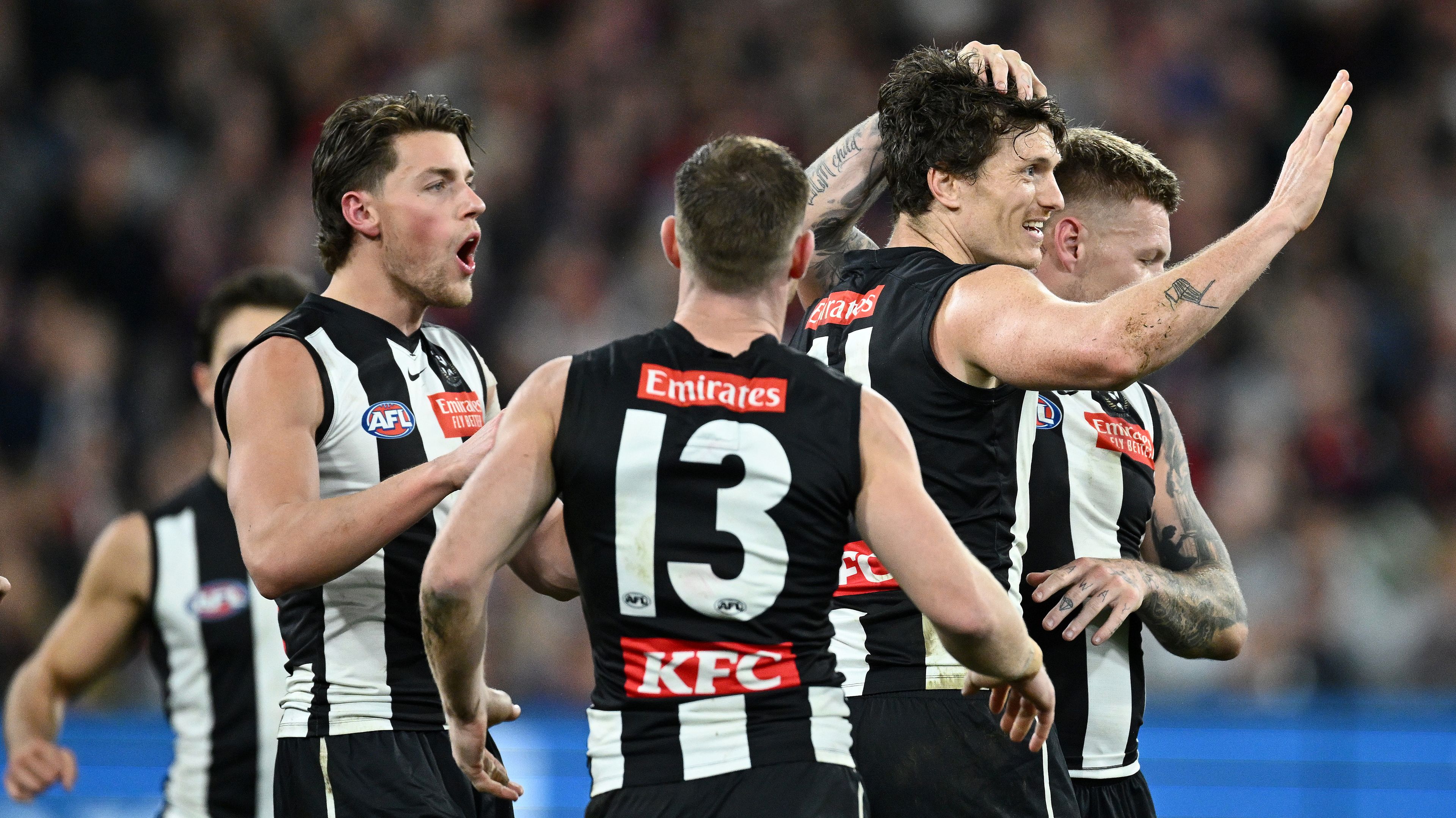 MELBOURNE, AUSTRALIA - SEPTEMBER 07: Brody Mihocek of the Magpies is congratulated by team mates after kicking a goal during the AFL First Qualifying Final match between Collingwood Magpies and Melbourne Demons at Melbourne Cricket Ground, on September 07, 2023, in Melbourne, Australia. (Photo by Quinn Rooney/Getty Images)