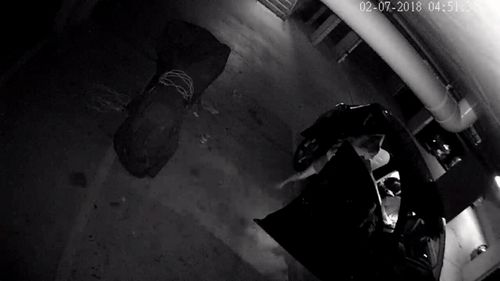 CCTV footage shows mother-of-two Sarah Brew chasing after the home invader in a nightgown (Supplied)