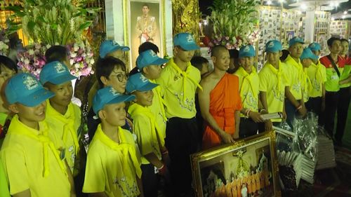 Thai boys thank “the world” as part of an evening ceremony. Picture: AP