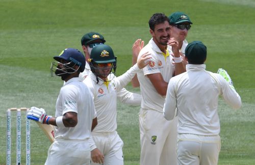 Mitchell Starc and his Aussie teammates, pictured celebrating the wicket of Virat Kohli at the MCG, will travel to England for an Ashes series in August.