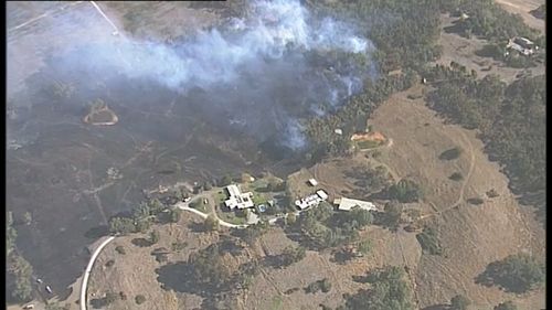 The blazes burned closed to homes. (9NEWS)