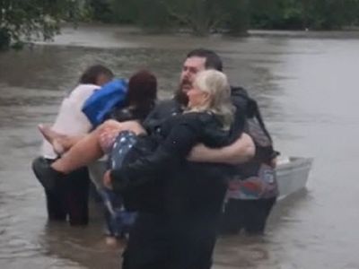 Woman rescued from flood waters