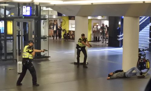 A teenage terror attack suspect was shot in just nine seconds after stabbing two US tourists in Amsterdam.