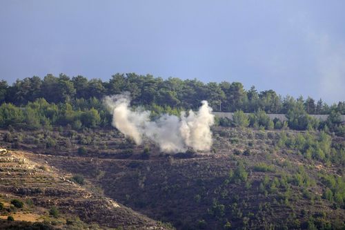 Smoke rises after a shelling in Bustan, a Lebanese border village with Israel, south Lebanon, Thursday, Oct. 19, 2023.  