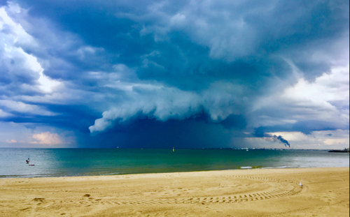 Dramatic Skies in St Kilda with Mobil's Altona refinery in the distance. (Sabrina Rubini)