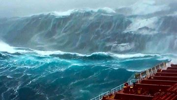 A ship sails through heavy swells in the North Sea.