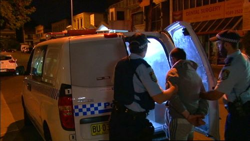 Two men were charged after police found several men armed with golf clubs and a wooden stick involved in a fight on Spring Street, Bondi Junction. (9NEWS)