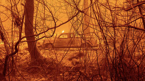 A scorched car rests in a clearing following the Bear Fire in Butte County, Calif., on Wednesday, Sept. 9, 2020. (AP Photo/Noah Berger)