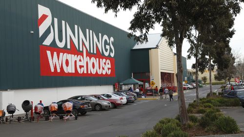 Melbourne, Australia - July 23, 2011: Bunnings is Australia's most successful hardware chain. Here is the outside of a store in Epping, Melbourne. It includes customers walking to the entrance, and cars parked nearby.