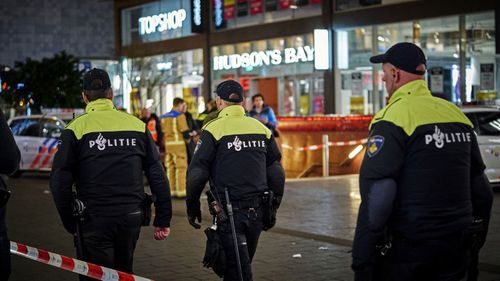 Dutch police secure a shopping street after a stabbing incident in the centre of The Hague, Netherlands, Friday, Nov. 29, 2019. 
