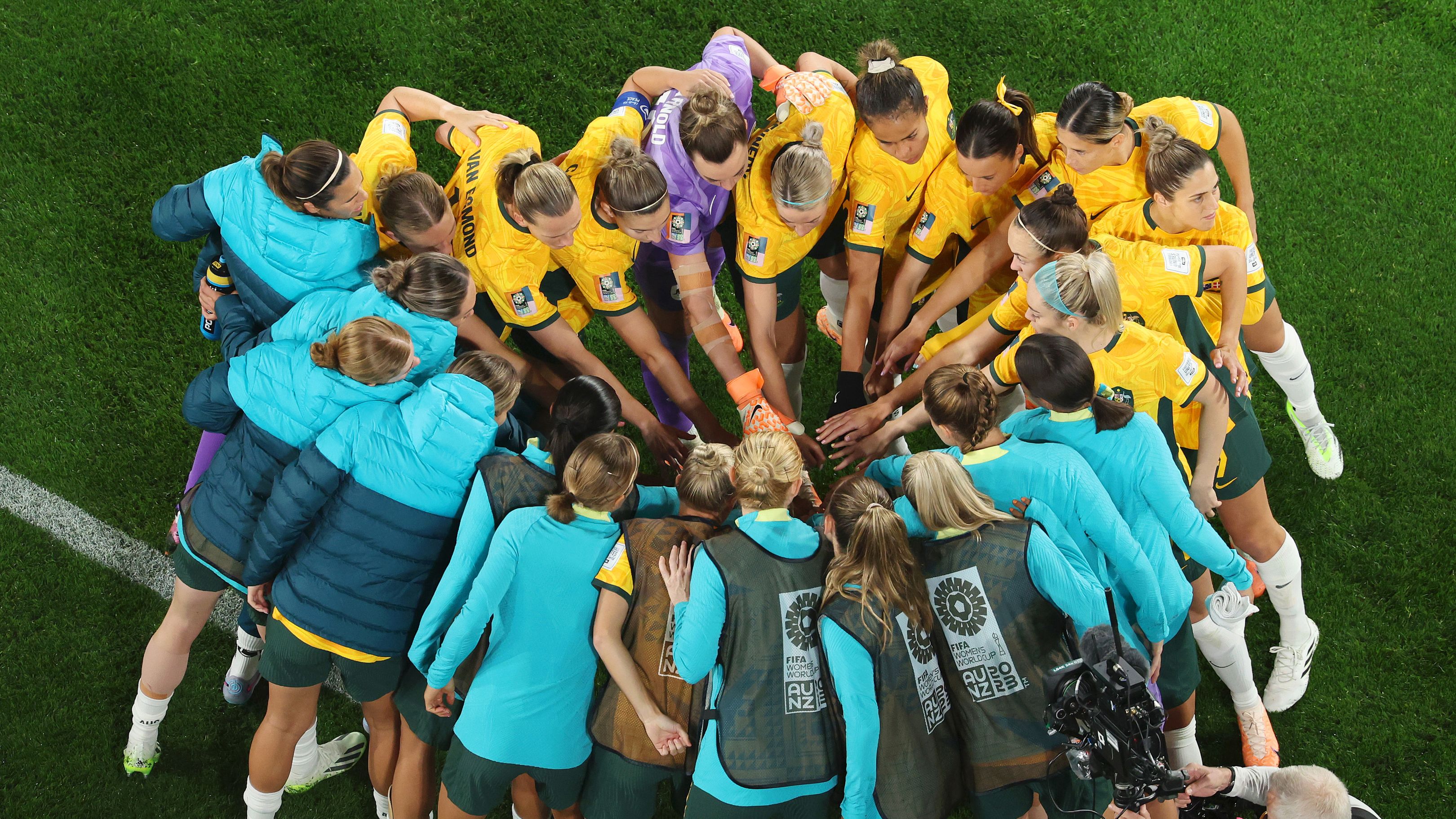 Australia huddle up ahead of their round of 16 match against Denmark.