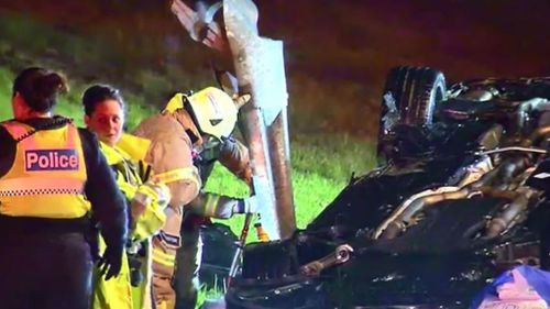 The passenger of a black Mercedes sedan was injured when a guard rail pierced through a car after it rolled on the Western Ring Road. (9NEWS)
