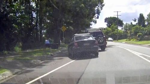 The man was lucky to stay upright after tripping over a gutter. (Dash Cam Owners Australia)