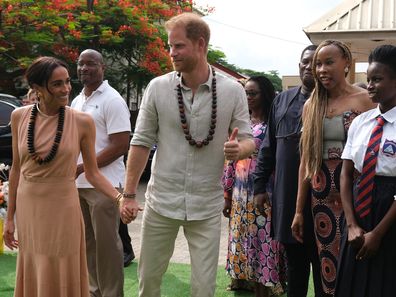  Duke of Sussex Prince Harry (2nd L) his wife Meghan Markle (L), Duchess of Sussex, visit the Lightway Academy in Abuja, Nigeria as part of celebrations of Invictus Games anniversary on May 10, 2024. 