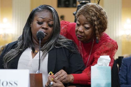 Wandrea "Shaye" Moss, a former Georgia election worker, is comforted by her mother, Ruby Freeman, right, as the House select committee investigating the Jan. 6 attack on the U.S. Capitol holds a hearing at the Capitol in Washington, June 21, 2022 