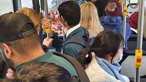 The photo, taken yesterday morning on a bus to Sydney's CBD, shows commuters unable to social distance.