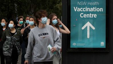 People arrive to be vaccinated at the New South Wales Health mass vaccination hub in Homebush.