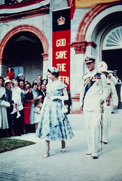 Queen Elizabeth II and Prince Philip leaves the House of Assembly in Hamilton, during a Commonwealth Visit to Bermuda, November 1953. (Photo by Hulton Archive/Getty Images)