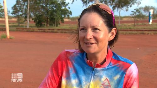 Queenslander Lisa Ashford, who is on a record-breaking ride around Australia, is hoping to outcycle a cyclone.