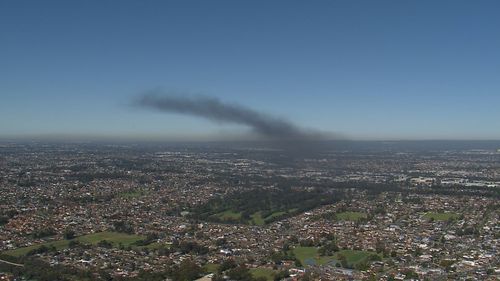 Dozens of firefighters are responding to a fifth alarm fire ﻿at a single-storey factory in Girraween.