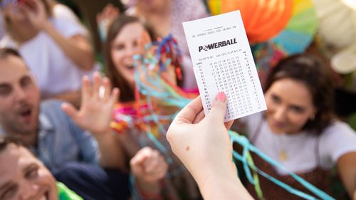 Mystery Sydney shopper wakes up $20 million richer after Powerball win, Victorian syndicate of 20 people each become millionaires in $20 million win