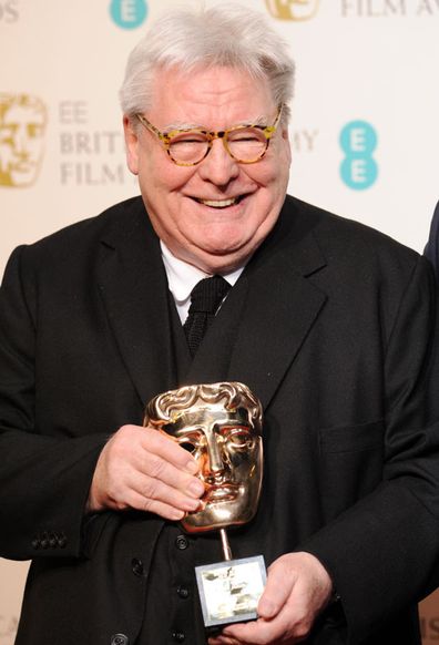 Sir Alan Parker, winner of the Fellowship award, poses in the press room at the EE British Academy Film Awards at The Royal Opera House on February 10, 2013 in London, England