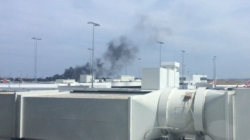 Smoke from the fires was visible from the airport terminals. (Twitter/@miss_nay_)