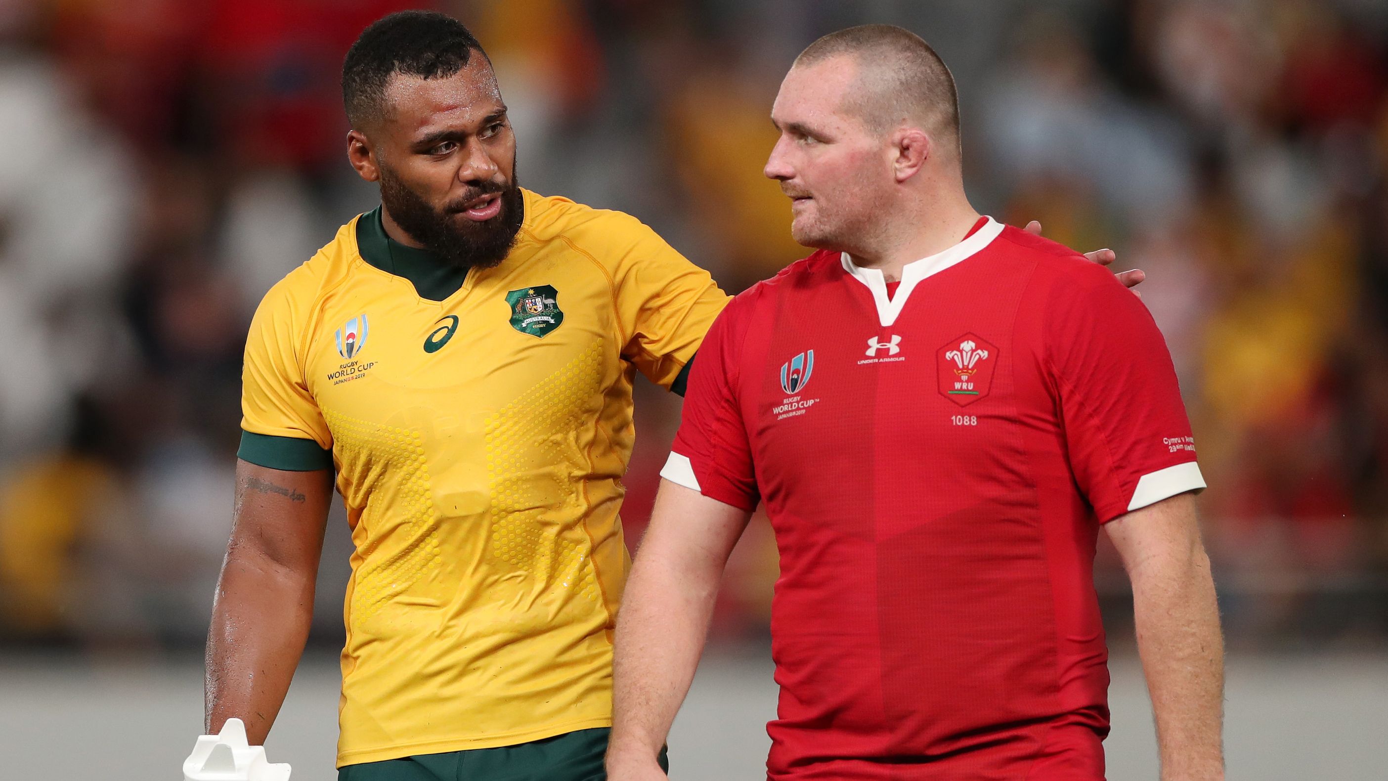 Samu Kerevi of Australia speaks with Ken Owens of Wales at the 2019 Rugby World Cup.