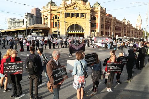 Animal rights protesters are blocking a CBD intersection. 