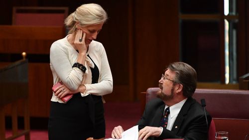 Labor Senator Katy Gallagher and Justice Party Senator Derryn Hinch during a debate on the Company Tax Bill. (AAP)