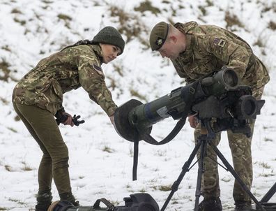 Kate,  Princess of Wales, Colonel, Irish Guards, is shown a weapon systems used by the Irish Guards for the first time since receiving the honorary appointment last year, during her first visit to the 1st Battalion Irish Guards since becoming Colonel, at the Salisbury Plain Training Area in Wiltshire, England, Wednesday March 8, 2023 