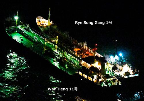 An image released by Japan's Ministry of Defense shows what it says is the Belize-flagged tanker Wan Heng 11 next to the North Korean-flagged Rye Song Gang 1 in the East China Sea carrying out a suspected banned “ship-to-ship” transfer. (AP).