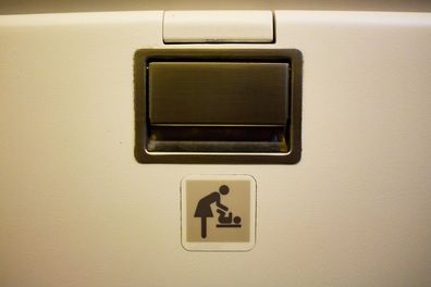 baby diaper change sign on a airplane