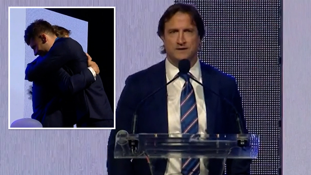 Luke Beveridge presents outgoing midfielder Josh Dunkley with the Charles Sutton Medal for the Western Bulldogs&#x27; best and fairest player.